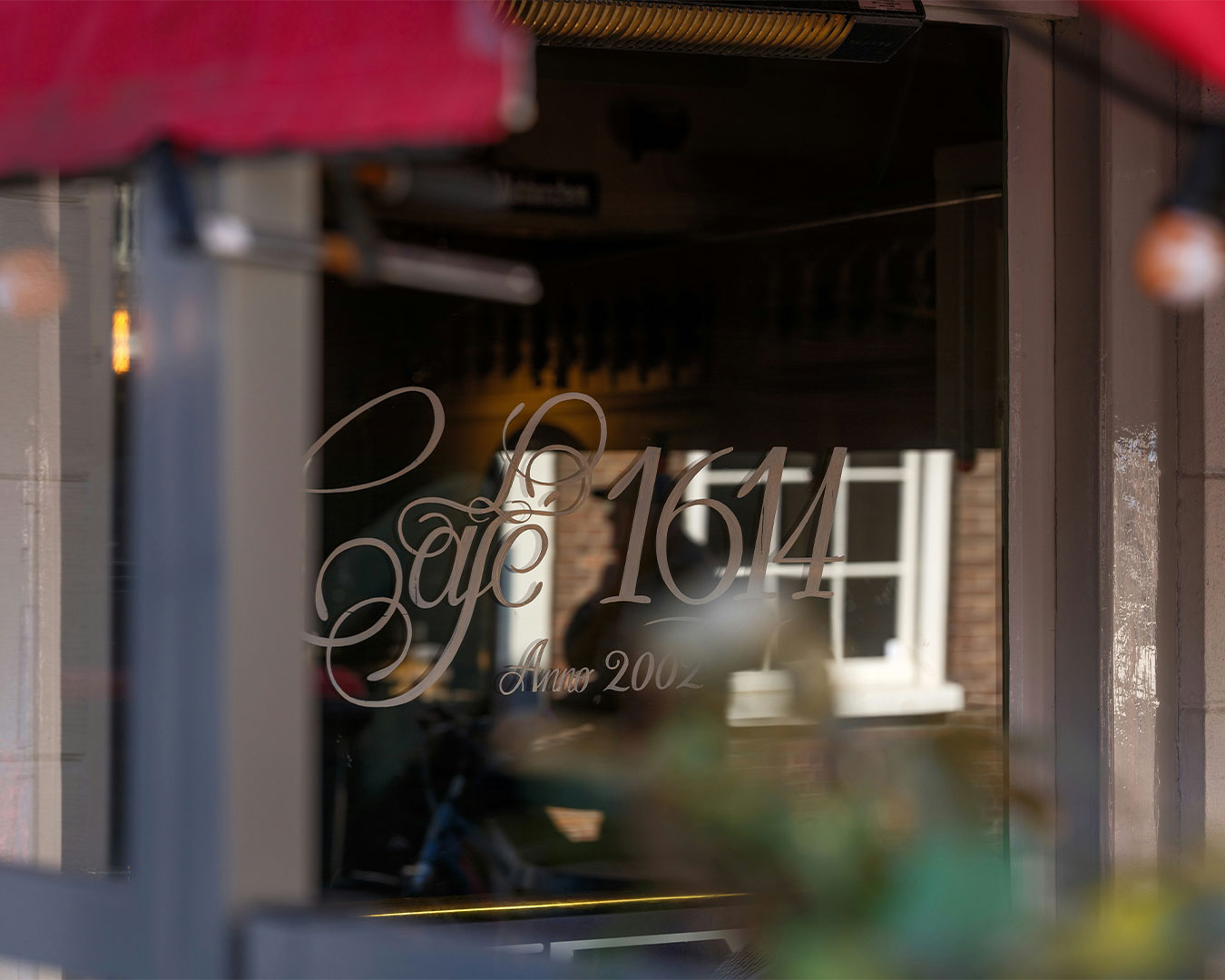 Exterior view of the restaurant entrance with clear signage and welcoming design, creating a warm and inviting first impression for visitors.